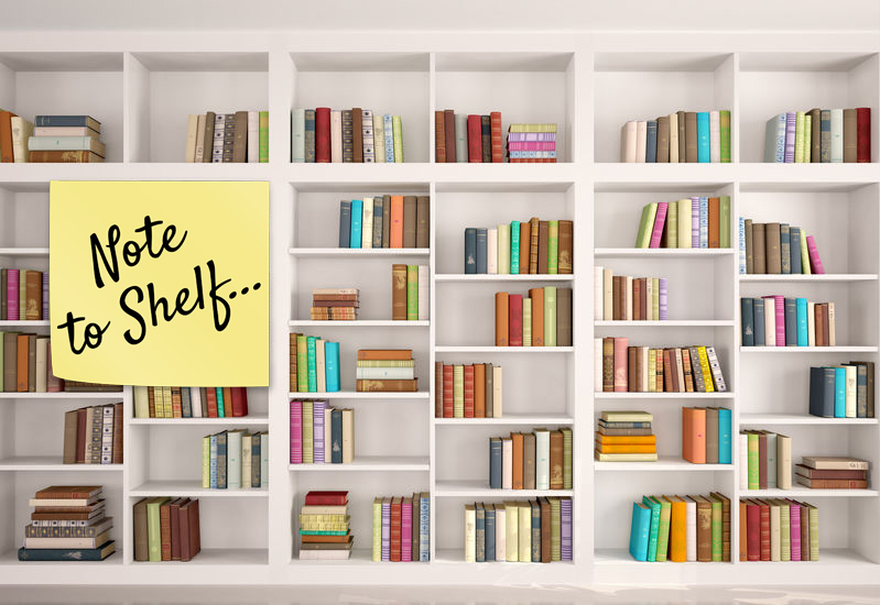 Bookshelves with "Note to Shelf" sticky note