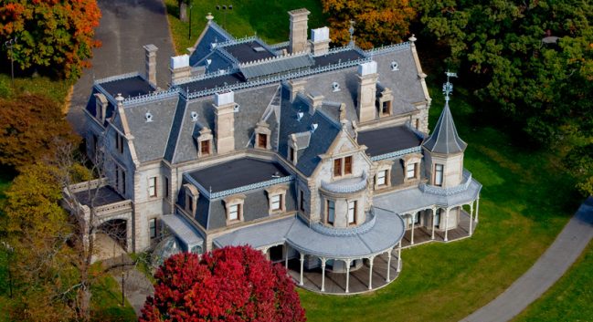 an aerial image of the Lockwood-Mathews Mansion Museum, located in norwalk, ct--it's a gray mansion with 4 chimneys from the 2nd Empire era