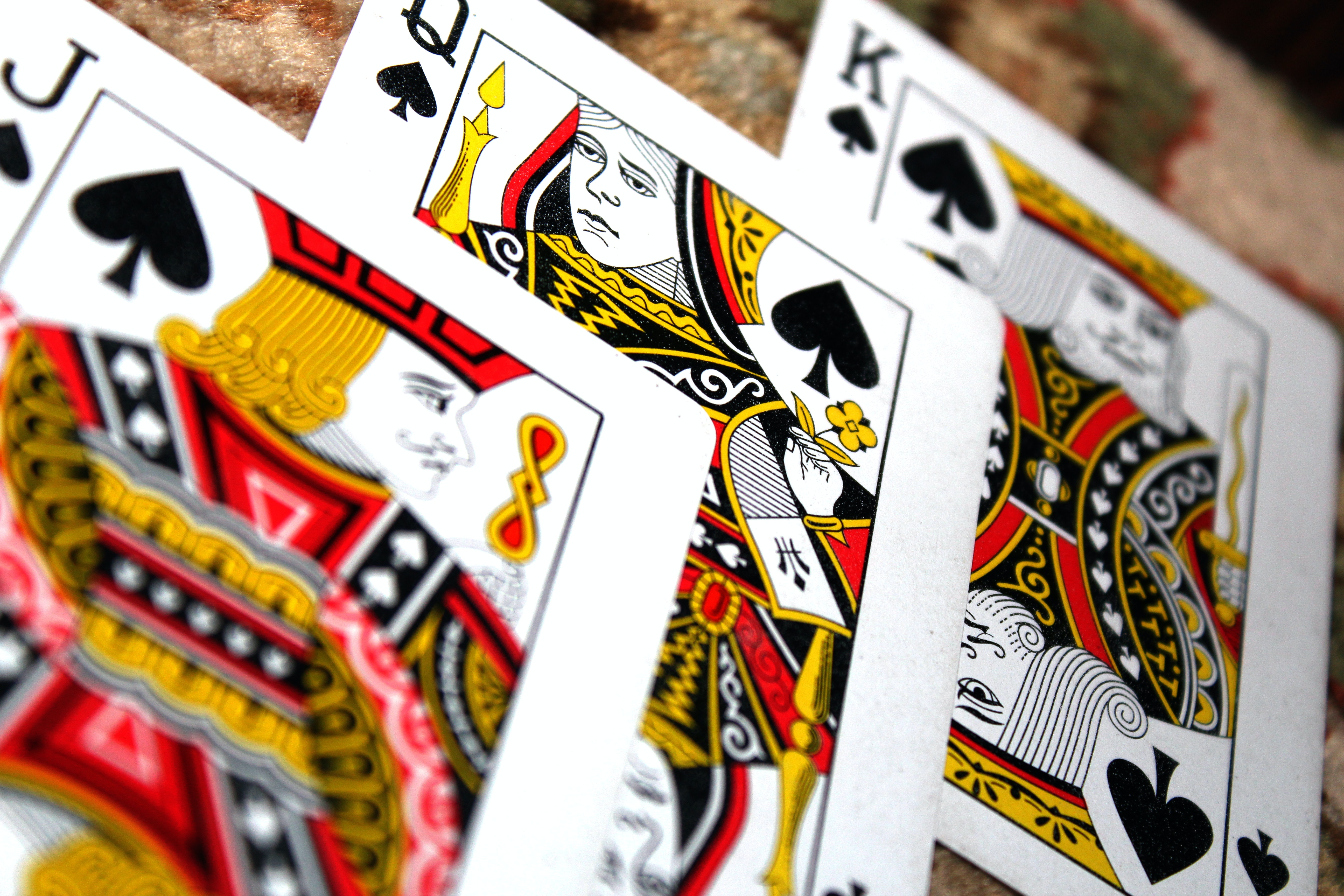 image of a deck of cards, jack of spades, queen of spades and king of spades