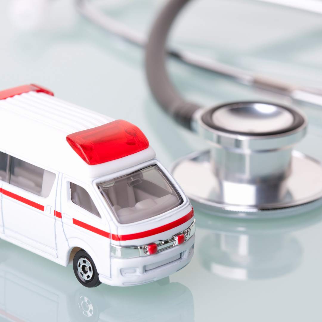 Toy ambulance in front of stethoscope