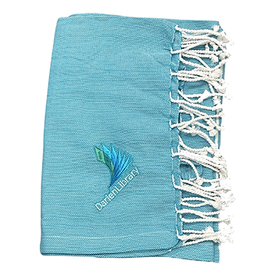 A light blue Turkish towel with Darien Library's logo embroidered on it.