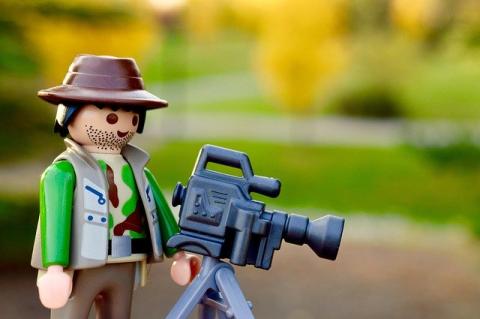 LEGO minifigure with a film camera camera 