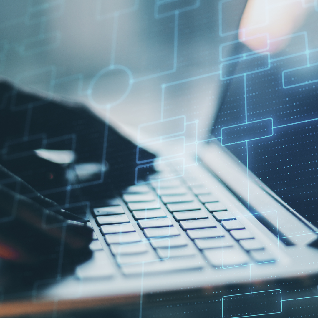 Hands on a keyboard with algorithm patterns in the background