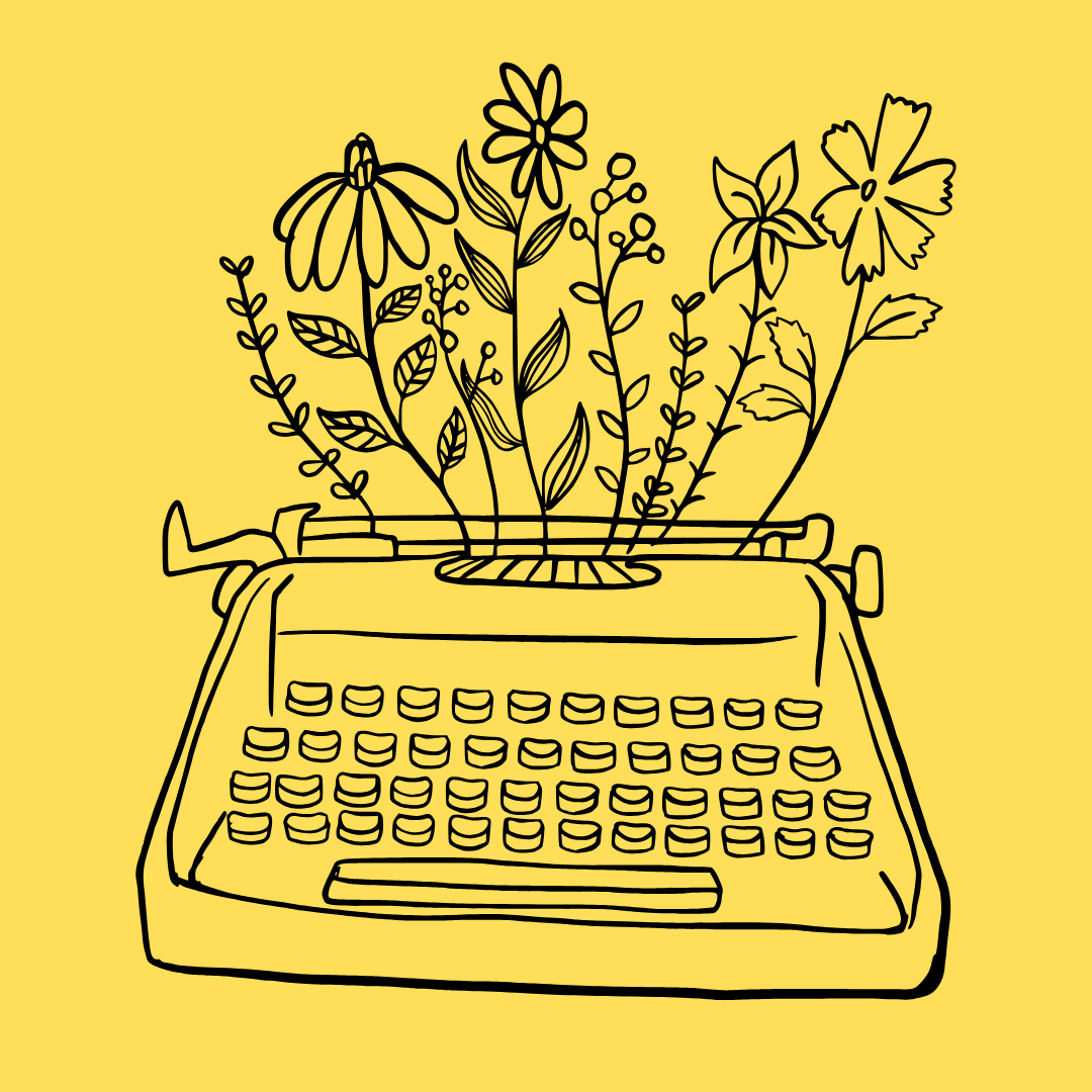 Typewriter with flowers growing  out of it 