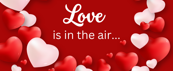 Red image with hearts and the text "Love is in the air..."